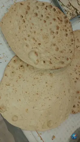 عکس نان تافتون تنوری خوشه؛ محله دورشهر قم 2